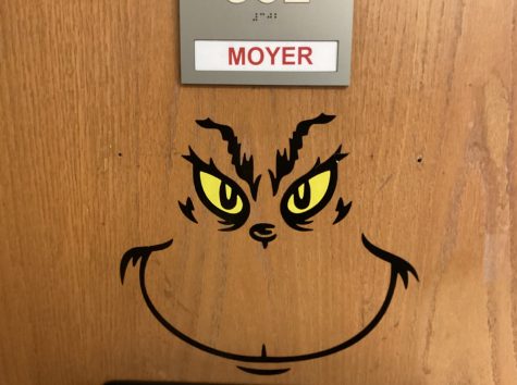 Students are greeted by the grinch when entering Moyer’s room. Look at those beautiful yellow eyes. 