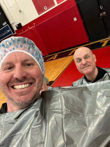 Mel Moyer and Mario Marcozzi pose before getting pied. They were pied by junior Nick Gomboz and junior Daniel Lanning.