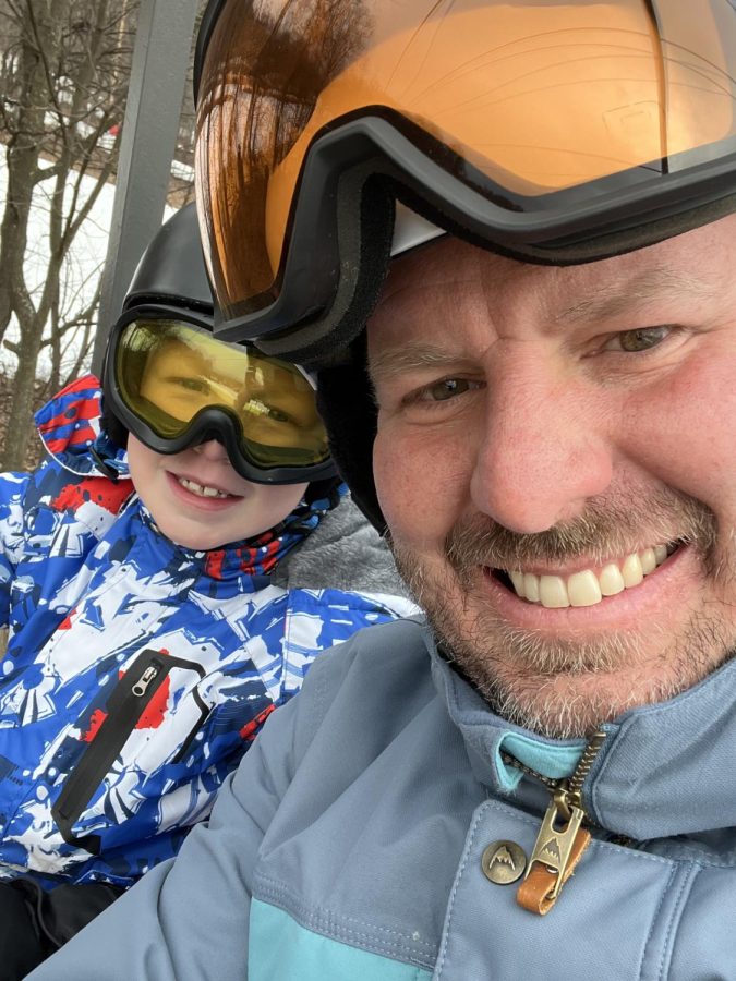 Mel+Moyer+and+his+son+take+a+ride+on+a+ski+lift.+Mr.+Moyer+teaches+English+literature+and+is+known+for+his+goofy+personality.