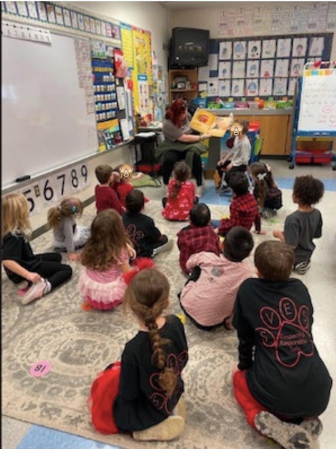 Big panther reads to a classroom. Big panther, Little panther is an organization that partners bigs with littles to show them how high school works. 