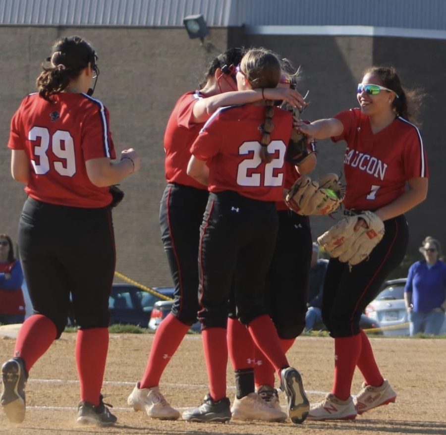 The+softball+team+embracing+during+a+game.+This+game+took+place+at+Saucon.
