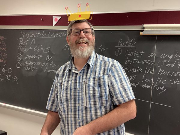 Mr. Svit poses for a picture with a big smile. This year, he not only teaches physics, but pre calc as well.