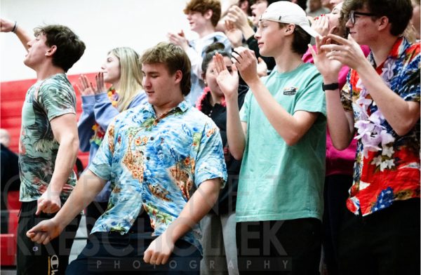 Shown above are seniors Oliver Blachnio, Luke Shimko along with Jungle leaders Ray Matey and Austin Zolnierz. They applaud the work well done of the boys basketball team. 
