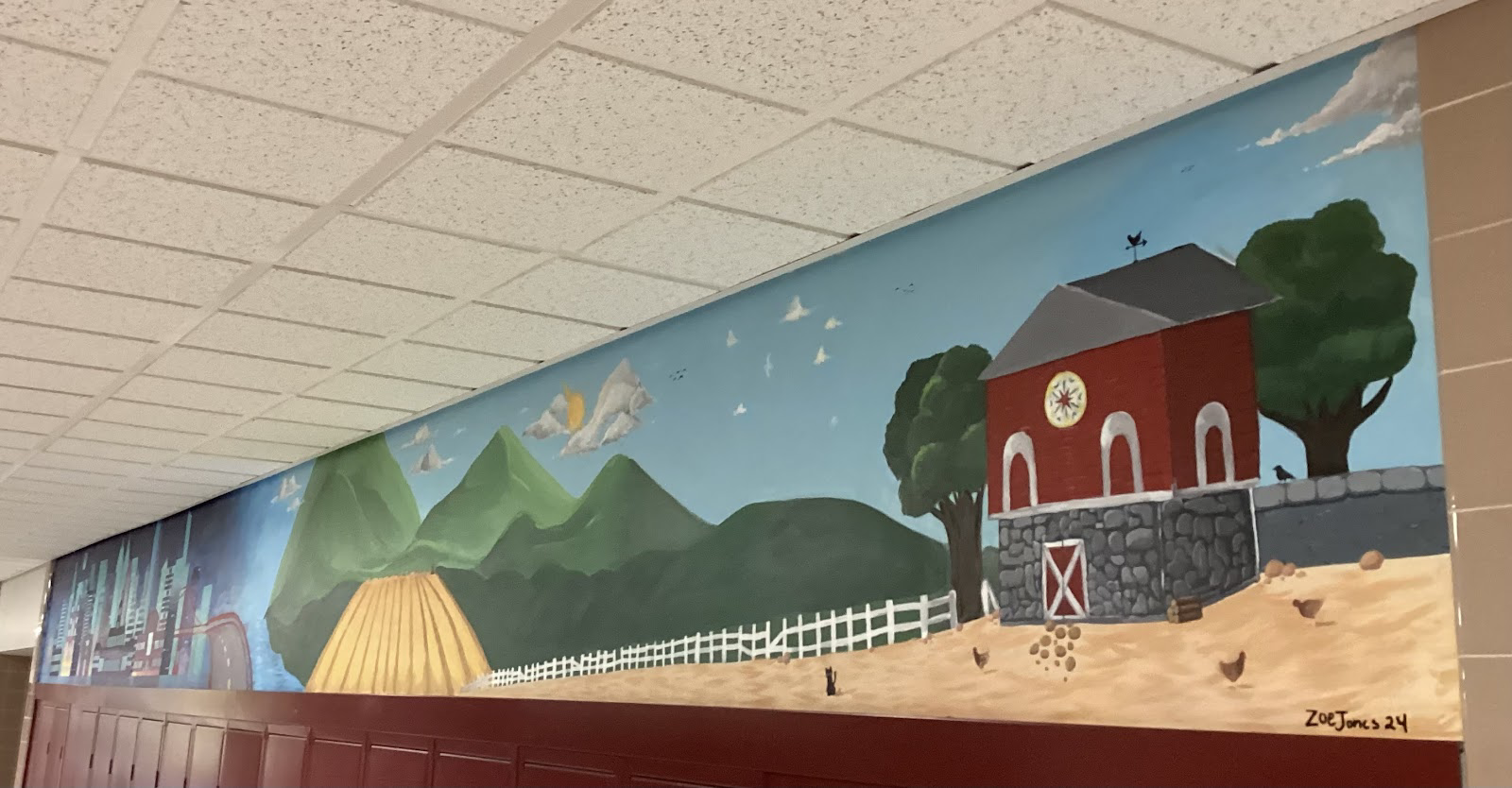 Mural in the 300 hallway above a stretch of lockers in between classrooms. The artwork was done by Senior Zoe Jones and 2023 graduate Rachel Kazane. 
