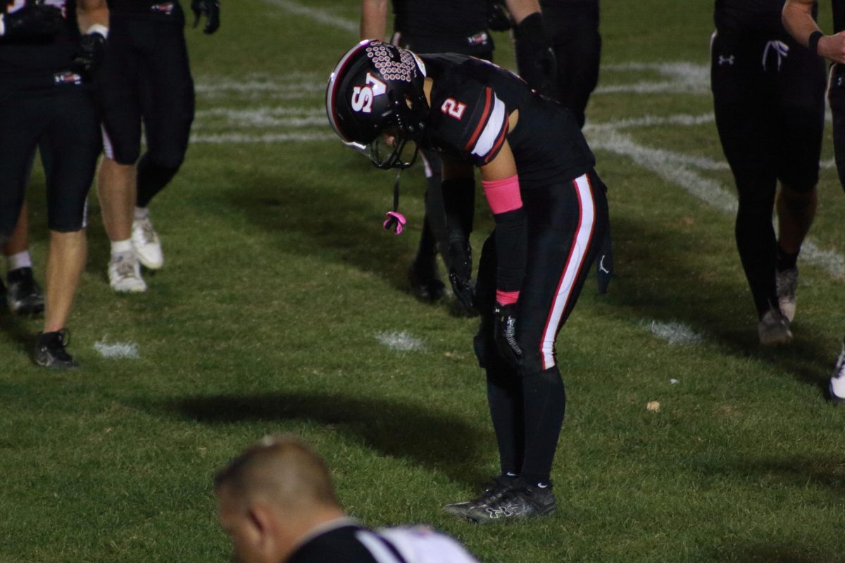 Senior Shane Kerosetz taking a small break off the field during time-out. 