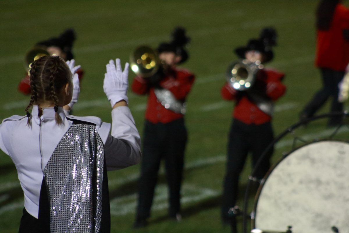 Senior Roberta Silverthorn conducting the marching bands “Arabian Tales” show.