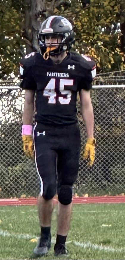 Pictured is John Kettle, number 45 on the high school football team. Wearing a black jersey for an away game for the panthers.