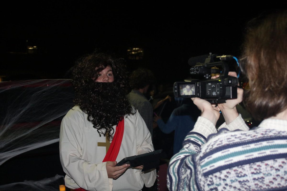 Senior Luke McGloughlin recording Senior Sean Fitzpatrick during the Trunk-Or-Treat event. 