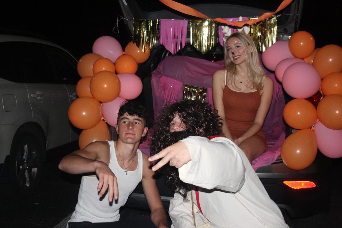 Seniors Sean Fitzpatrick, Peter Albano and Payton Kichline strike a pose for the Trunk-Or-Treat event.