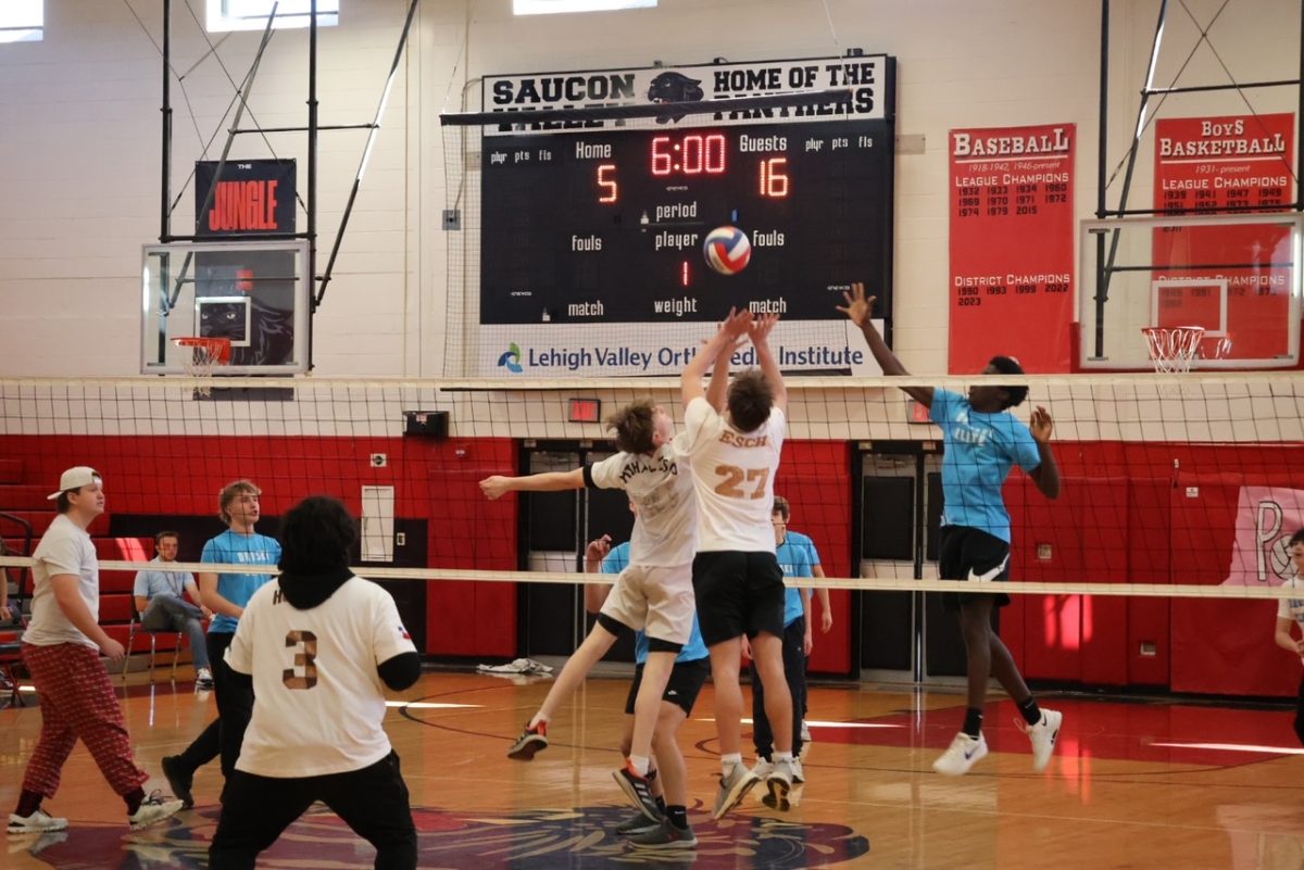 Clash of students jumping for the ball.