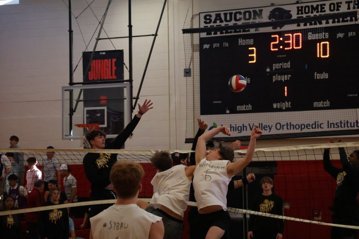 Group of players going for the block.