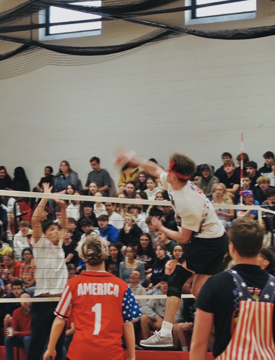 A powderpuff player spiking the ball down.