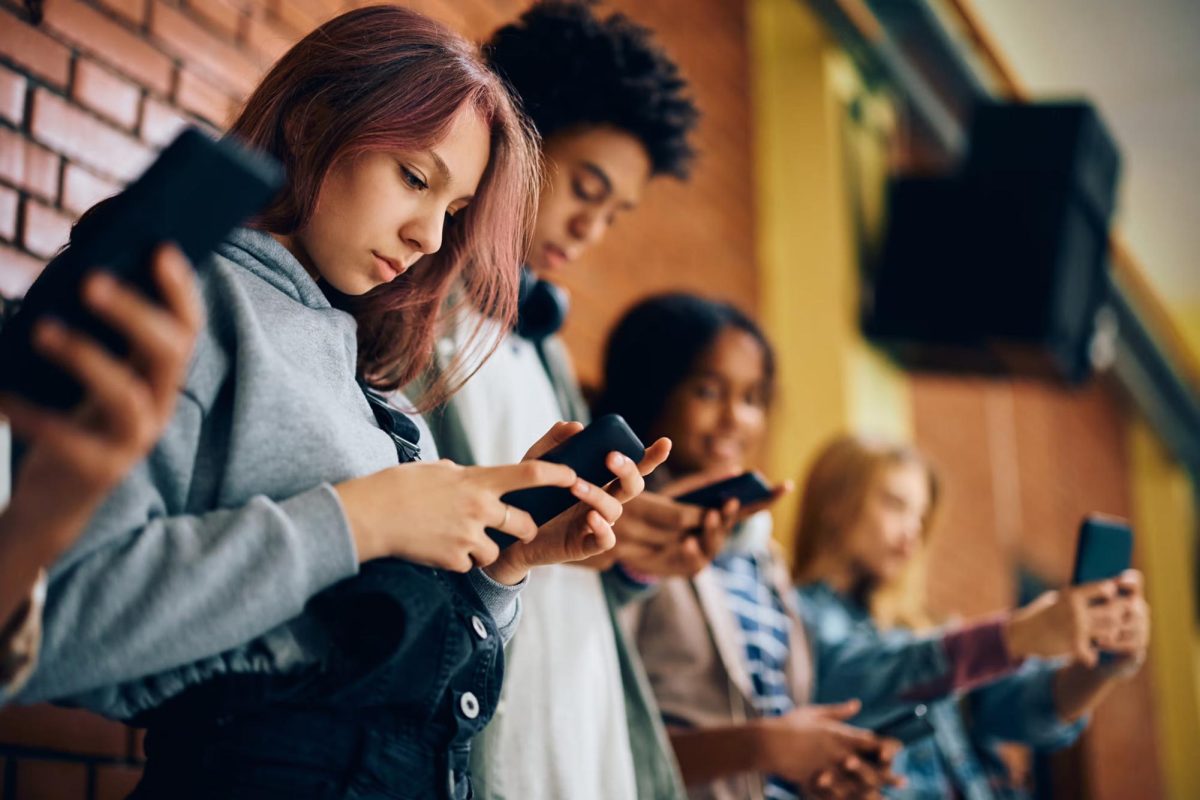 An example of teens using their smartphones.

